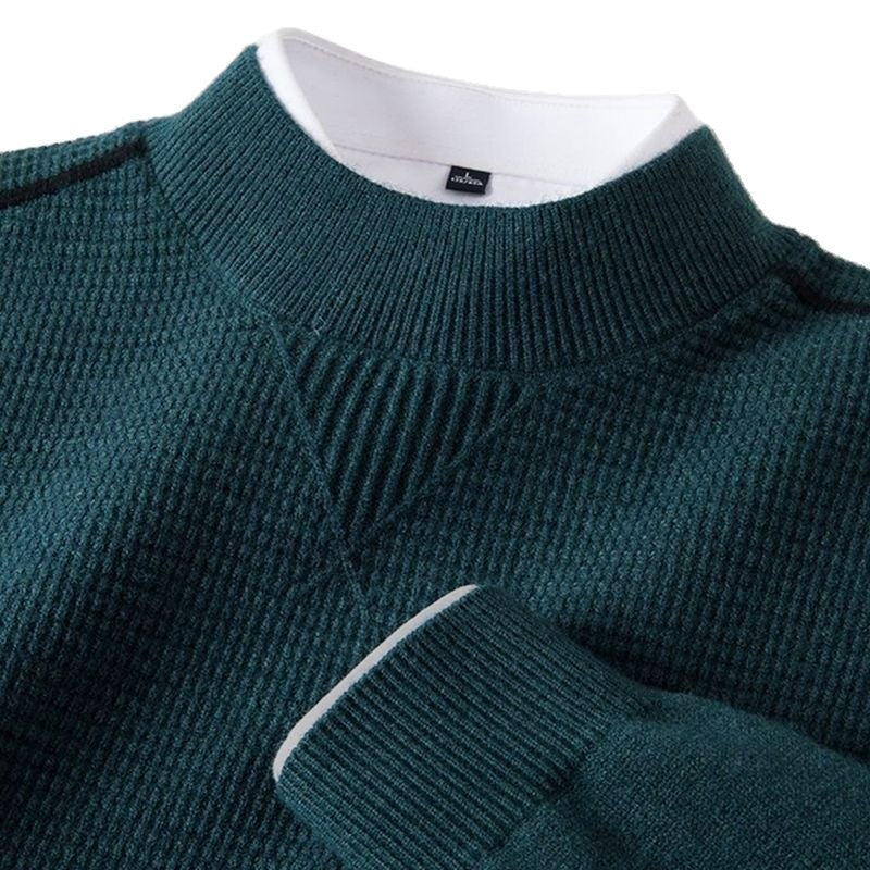 Dark teal textured knit top neckline close-up with ribbed stand-up collar and V-shaped insert