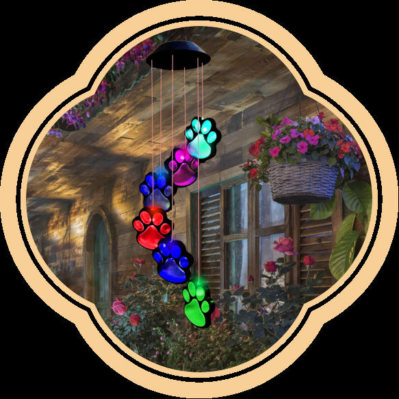 Dog paw LED figures glowing in several colors, hanging from a solar lamp head, black housing option