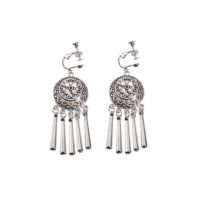 Bohemian vintage clip-on tassel drop earrings on a zinc alloy frame, handmade boho pair on white studio background