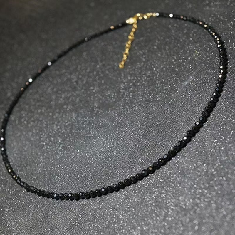 Black faceted glass bead necklace showing the sparkle of the cut glass beads