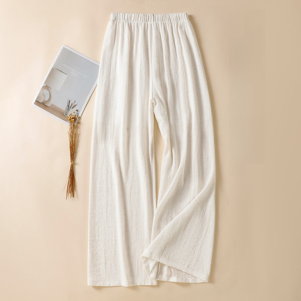 White wide leg linen blend trousers showing full length hem and straight leg