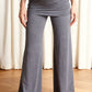 Blue palazzo yoga pants at full length with fold over waist