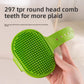 Hand holding the avocado green TPR groomer brush showing rows of rounded rubber comb teeth on the oval head