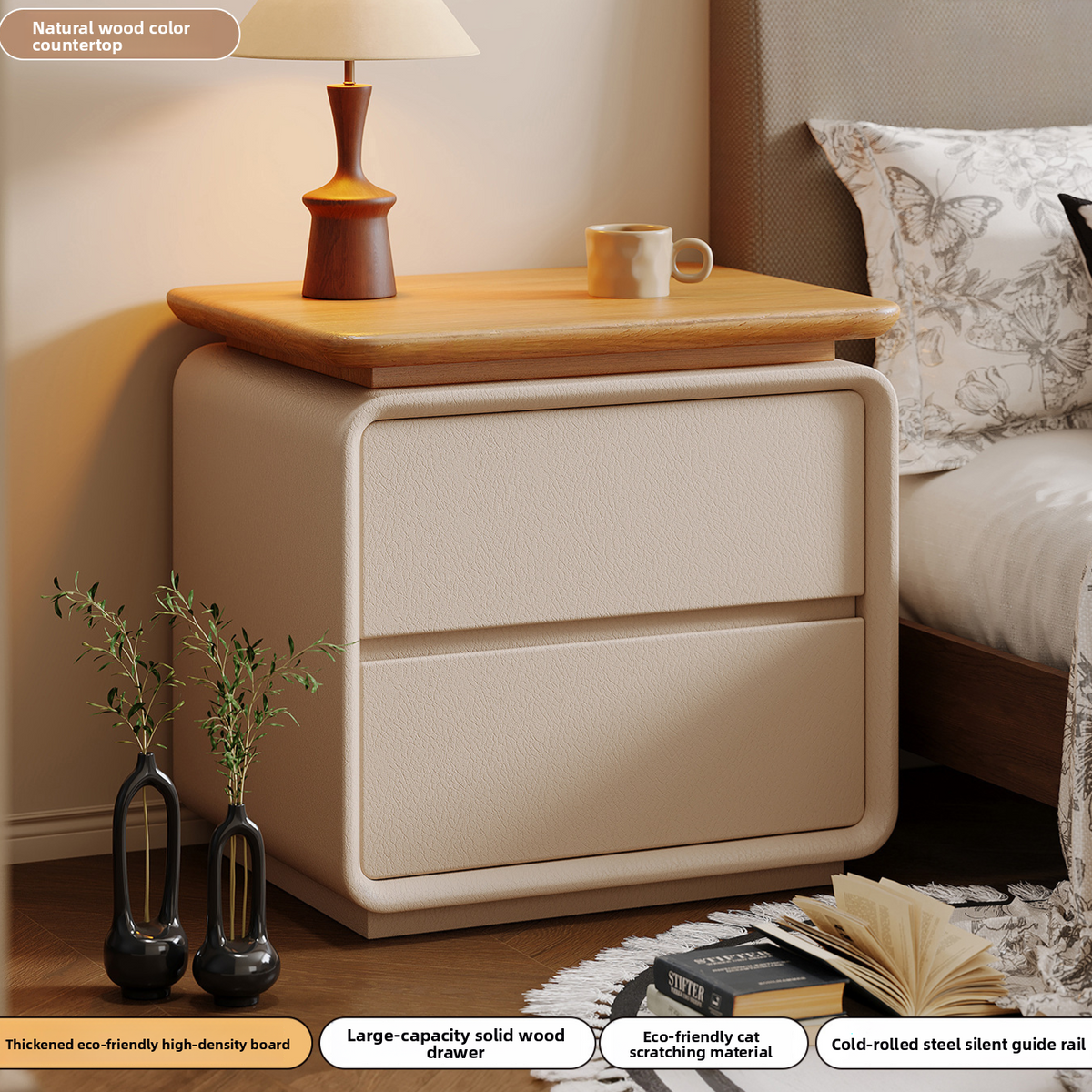 Bedside cabinet shown next to a bed with layered bedding
