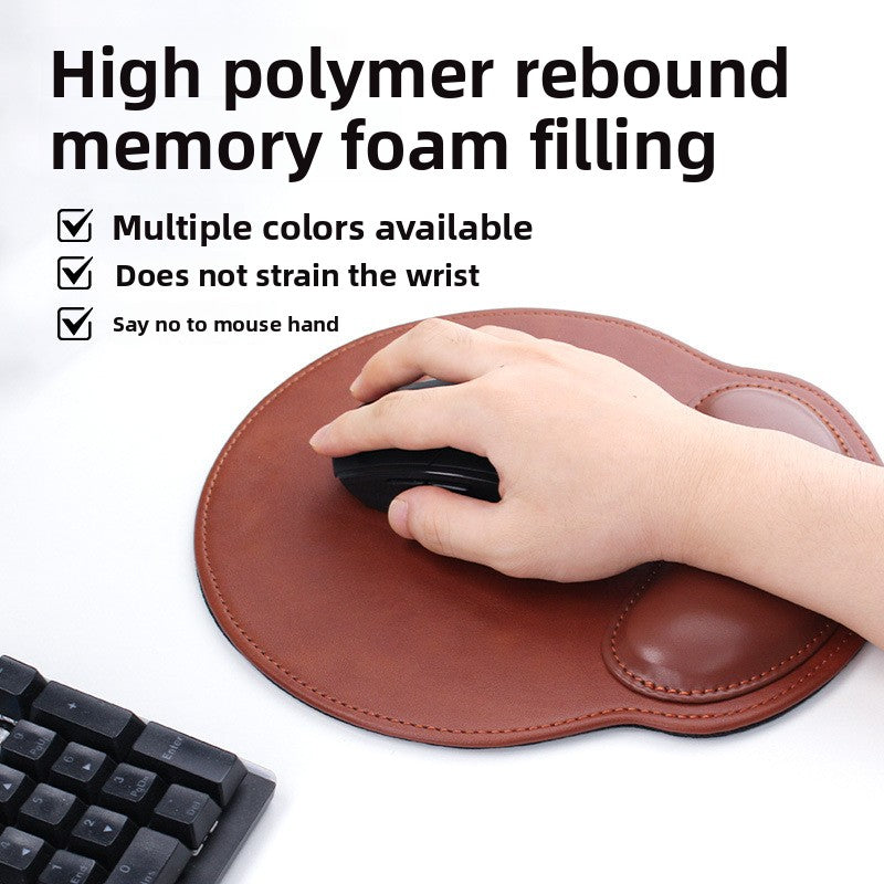 Close view of the soft memory foam wrist bolster on a leather look mouse pad