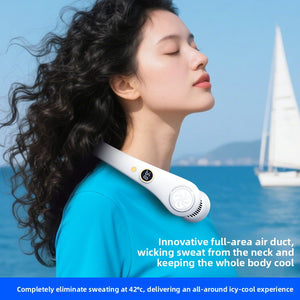 Woman at the beach wearing the white neck fan hands-free as her hair lifts in the breeze