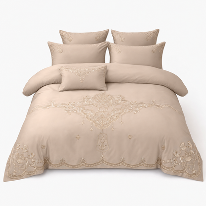 Embroidered duvet cover smoothed across the marital bed