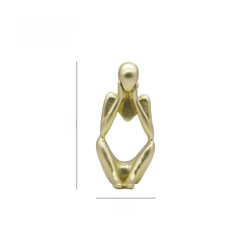 Gold abstract resin meditator figurine shown with a height guide on a plain white background