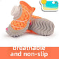 Black and orange dog shoes shown together to compare the knob and snap closures