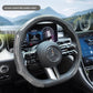 Silver steering wheel cover fitted on a car wheel