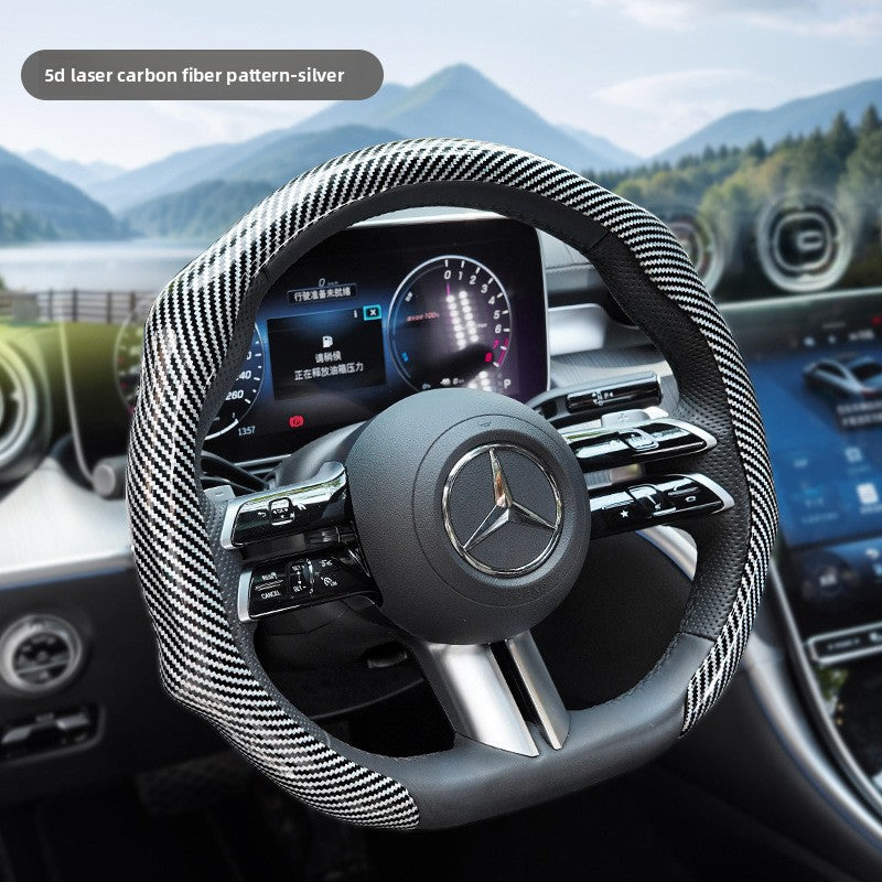 Silver steering wheel cover fitted on a car wheel