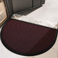 Semi circular polyester door mat with bound edge shown against a light floor