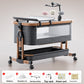 Gray baby crib with a nursing table and a hanging cloud mobile, Toy model shown, wood grain gray option