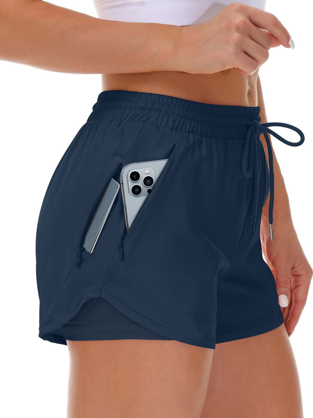 A navy blue womens two in one fitness shorts with a side phone pocket and inner liner, front view