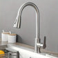 Brushed steel pull out kitchen faucet installed on a sink deck, single lever handle to the right