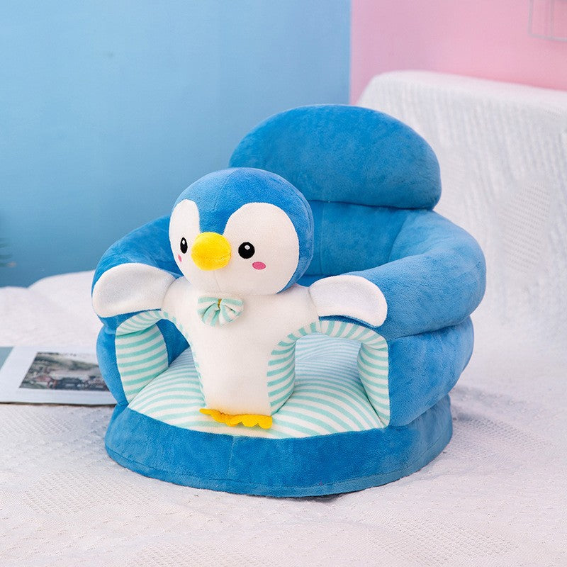 Blue plush baby floor seat with a penguin at the front and a soft padded seating ring