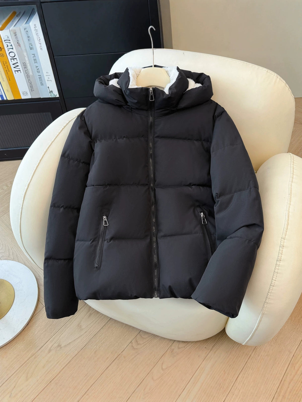 Padded winter puffer jacket with a detachable hood and two zippered front pockets