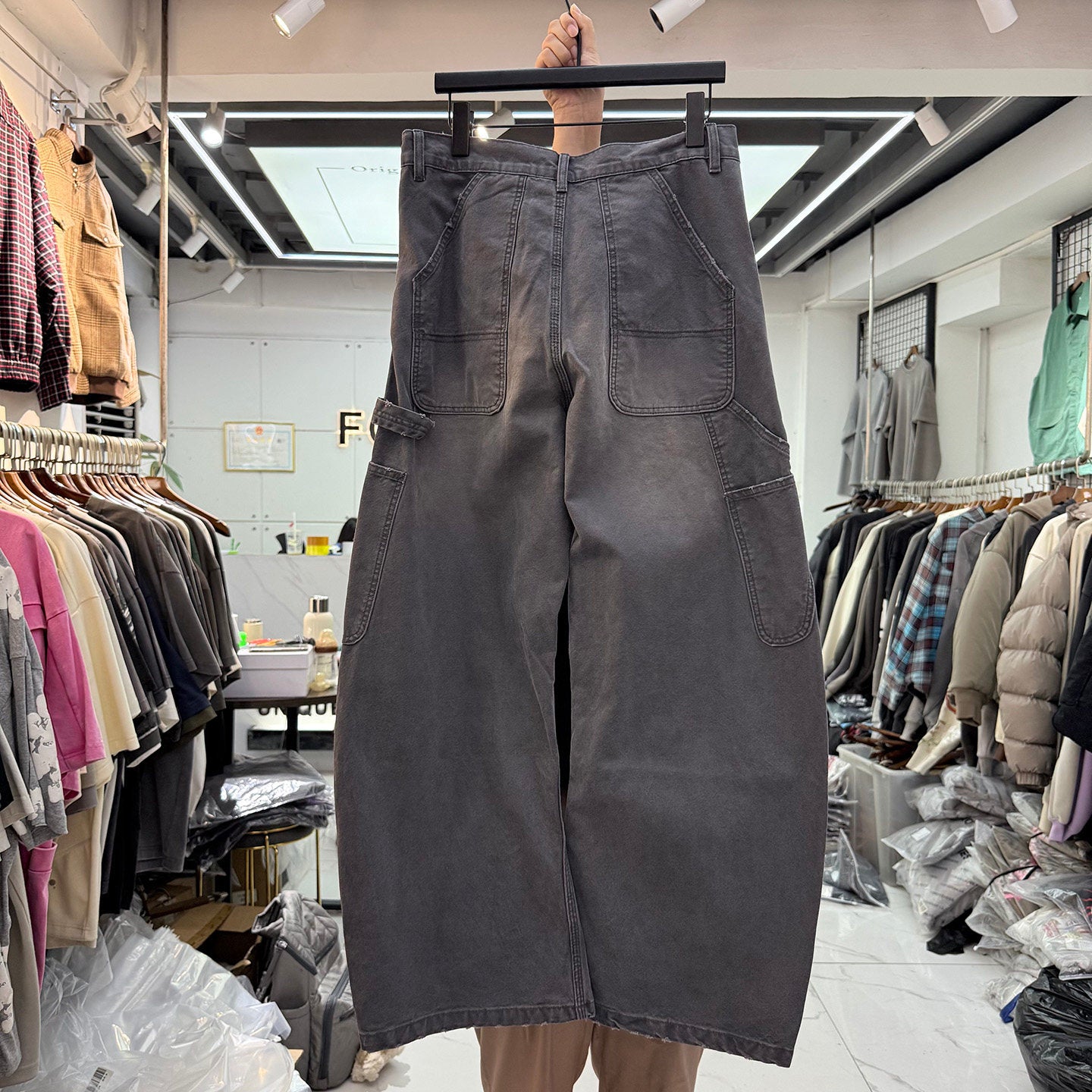 Charcoal gray carpenter pants back view with patch pockets and hammer loop