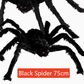 Hairy black Halloween spider prop with red eyes, flocked body and eight posable bendable legs