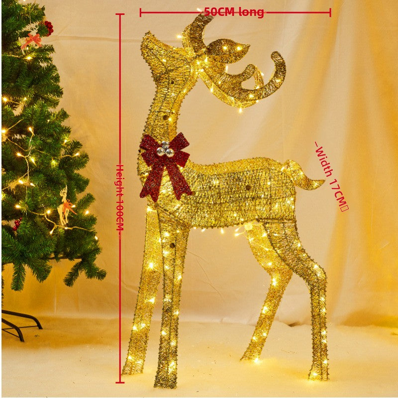 Golden lit reindeer with a red bow, 100 cm tall, 50 cm long and 17 cm wide on the maker's drawing, semi-round variant