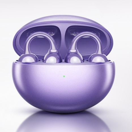 Starry black open ear clip earbuds beside the closed charging case