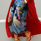 Wide leg cropped denim jeans with watercolor abstract and polka dot print, red coat and heels