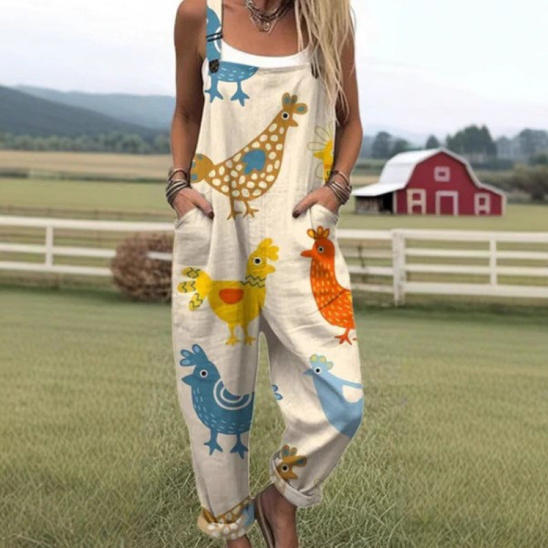 Loose overall jumpsuit worn over a tee, button straps and rolled cuffs