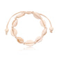 Cowrie shell anklet on a cream knotted cord with sliding tie ends and two bone tone beads