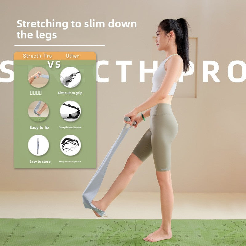 Wide fabric yoga stretching strap with a bar handle and a foot loop used standing to reach a raised foot