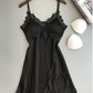 Ice silk lace cami nightgown in black on a hanger with removable triangle bust pads beside it, hem and lace view