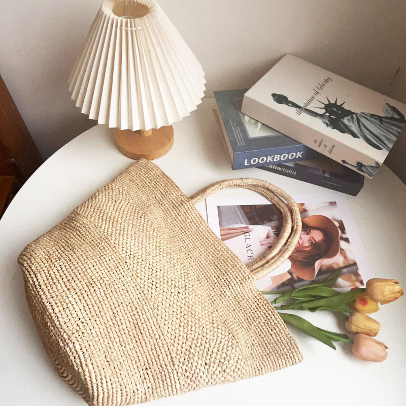 Handwoven Natural Straw Summer Handbag | scale reference with hand