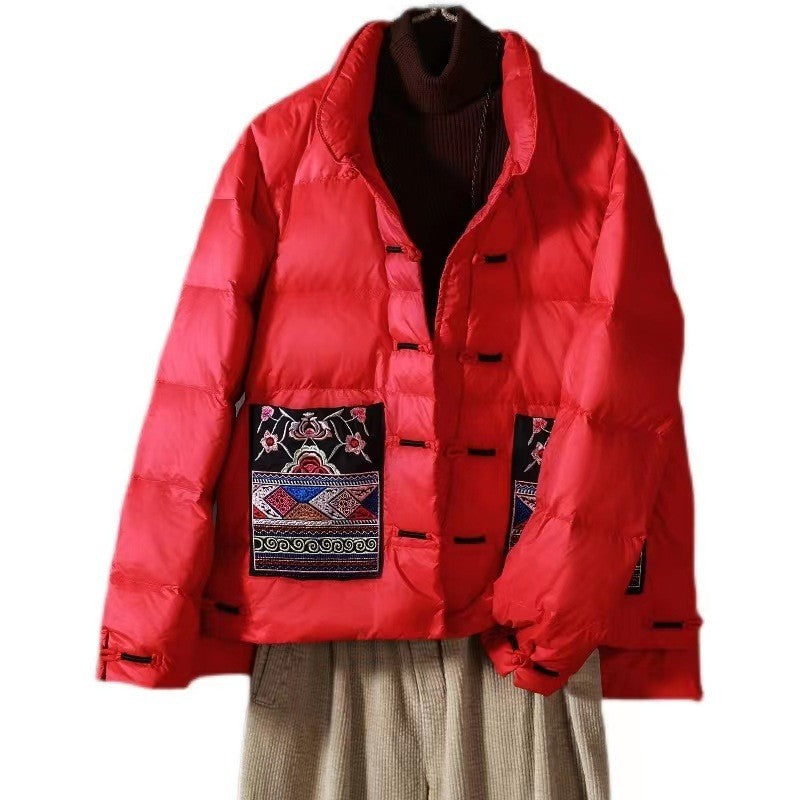 Two embroidered ethnic patch pockets on the quilted down jacket