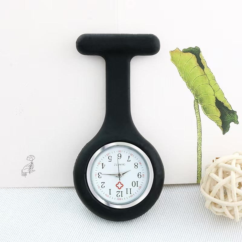 White silicone nurse fob watch with a plain analog quartz dial, studio shot