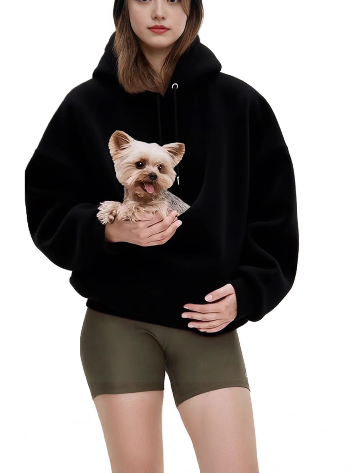 Small dog resting in the front kangaroo pouch of the pink plush fleece hooded sweatshirt