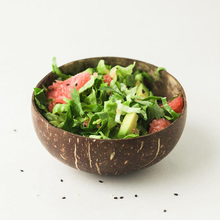 Regular coconut shell bowl filled with salad, grapefruit and avocado, Regular bowl option photo