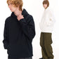 A man in a navy pullover hoodie and a woman in a white hoodie standing side by side against a white background