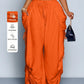 High waist wide leg linen look viscose drawstring trousers, side view of the loose drawstring trousers