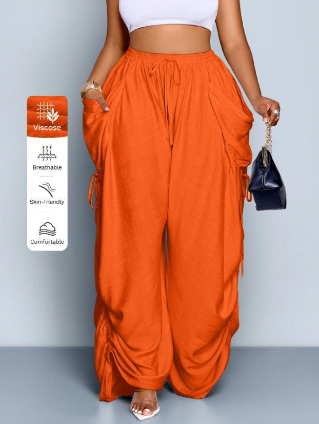 High waist wide leg linen look viscose drawstring trousers, side view of the loose drawstring trousers