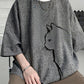 Linen blend t-shirt laid flat showing the full short sleeve shape