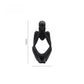 Matte black abstract resin meditator figurine in a calm seated thinking pose for home decor