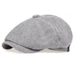 Vintage newsboy flat cap with an adjustable back tab and short stitched brim