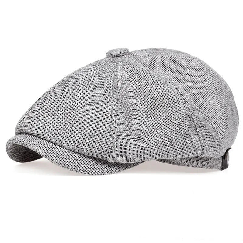 Vintage newsboy flat cap with an adjustable back tab and short stitched brim