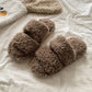 Close view of the faux fur footbed and low PVC sole of the open toe slipper