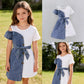 Girls' patchwork denim dress side profile showing belt at waist