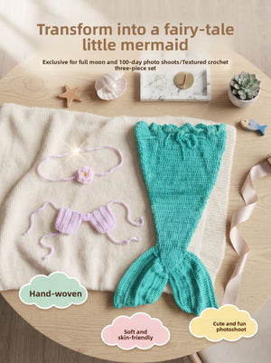 Flat lay of the three piece mermaid set, teal tail with pink tie back top and flower headband on a blanket
