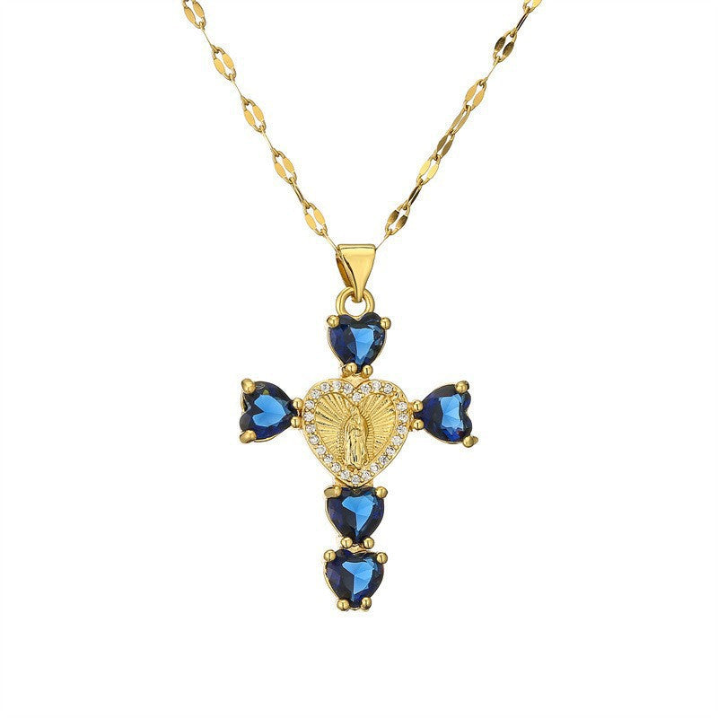Gold tone cubic zirconia cross pendant with a shaped bail and lobster style clasp