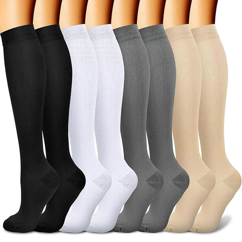 Patterned compression socks lined up to show calf coverage and knee-high length