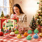 Woman smiling at a pink squishy dumpling in a Santa hat beside the calendar box and festive squishies on a table