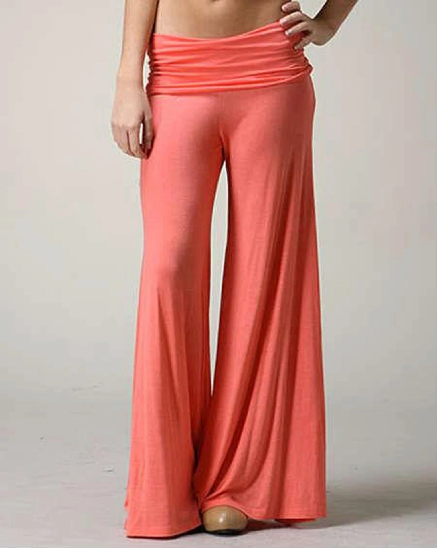 Blue wide leg palazzo pants draping to a floor grazing hem