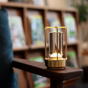 Rechargeable table lamp with lit acrylic column and metal frame